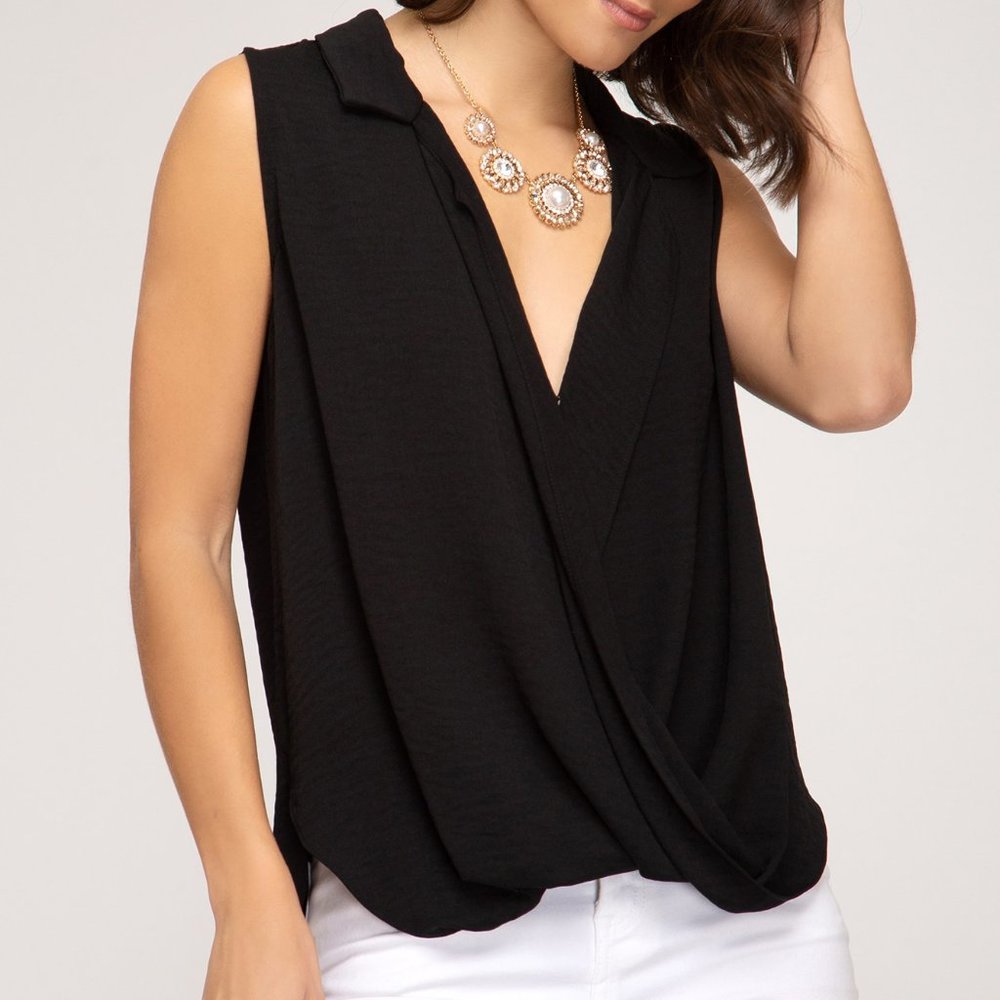 Sleeveless black surplice top